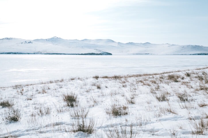 Winter landscape with lake and mountains