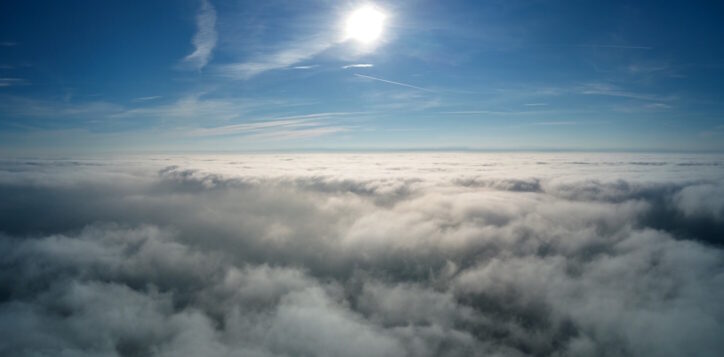 Aerial view from high altitude of earth covered with puffy rainy clouds forming before rainstorm