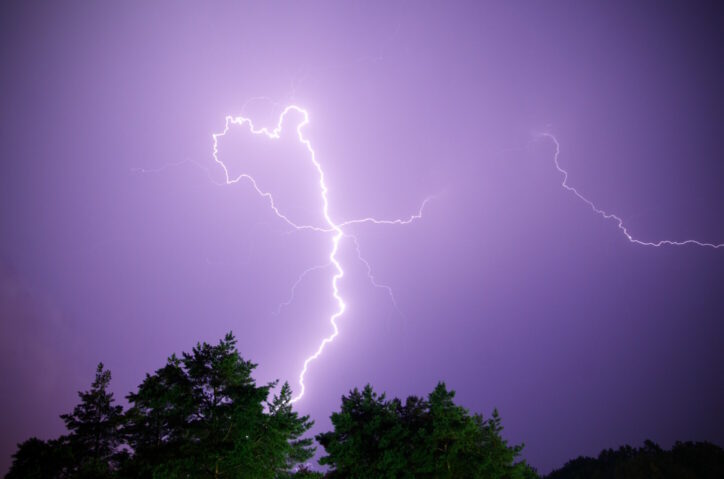 Lightning strike on the dark cloudy sky