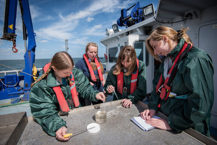 Photo of marine biologist with students